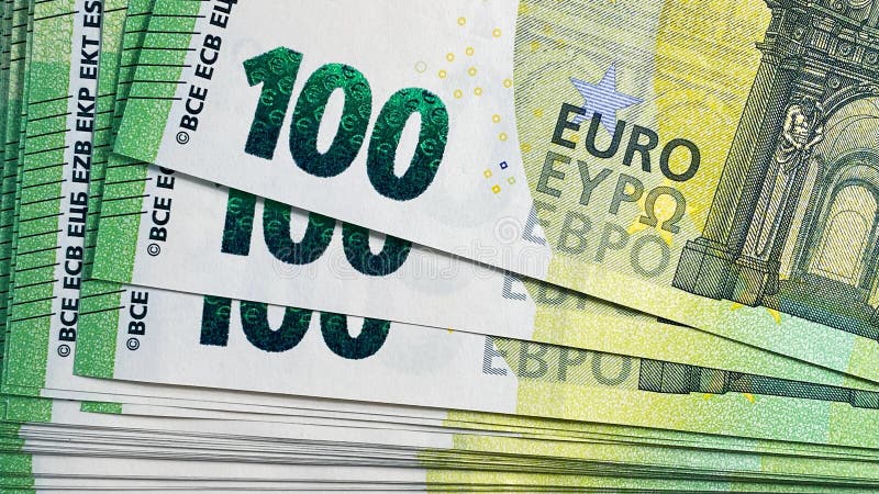 100 euro bills. Top view of a stack of hundred Euro notes. Close-up. The single currency of the European Union. Cash banknotes.