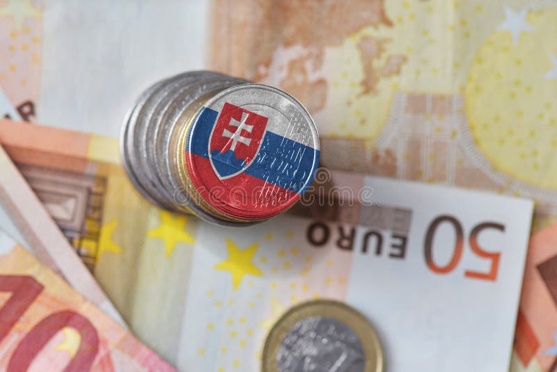 Euro coin with national flag of slovakia on the euro money banknotes background