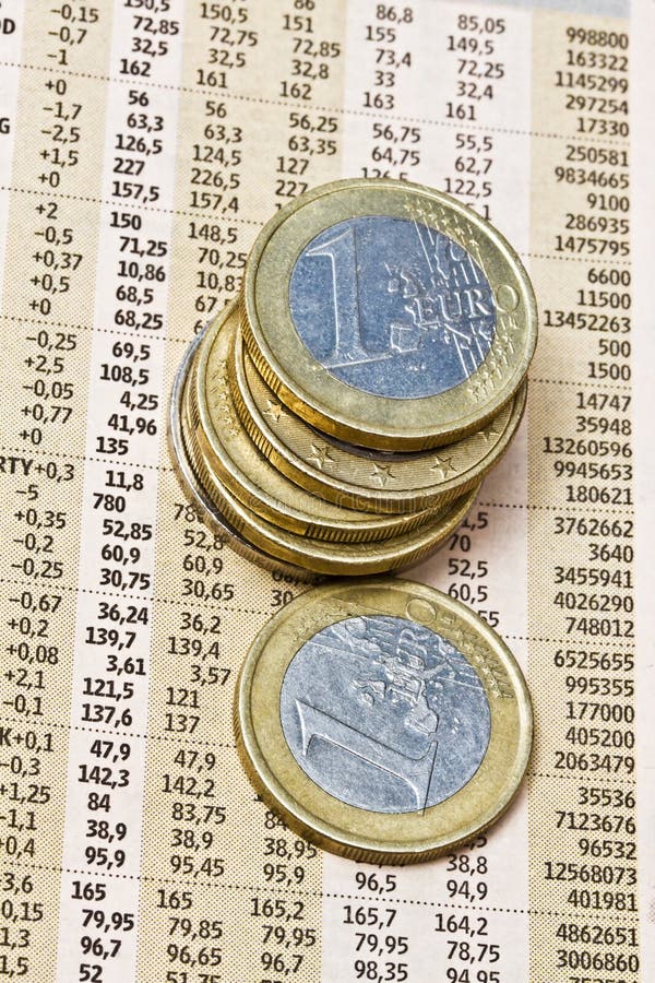 Euro coins on a financial newspaper