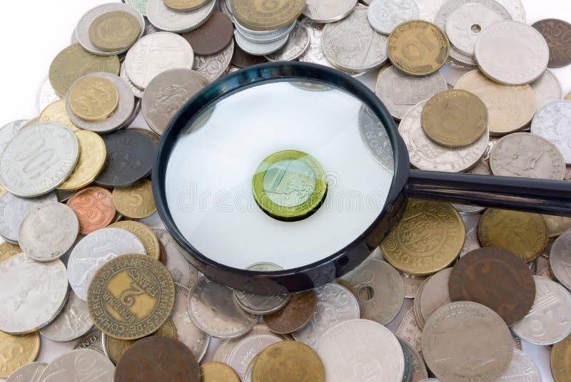 Euro surrounded by old European coins