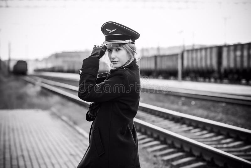 Woman in Uniform at Railway Station Stock Photo - Image of caution ...