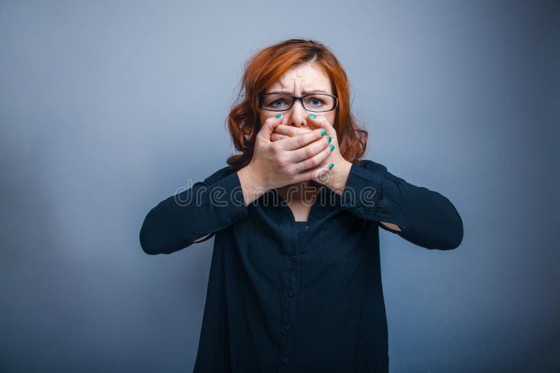 European appearance redheaded girl in glasses