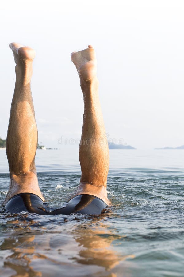 A European man diving underwater at Koh Mak, Tra