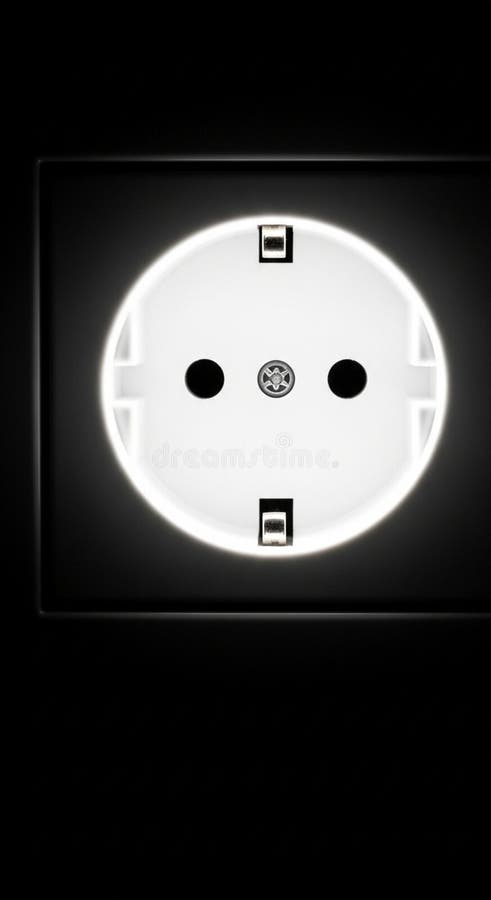 European-style electrical socket, featuring two circular pin holes and a grounding pin hole in the center. The socket has a white faceplate, set against a dark background, and is enclosed in a square frame. It's commonly used for appliances in Europe, designed to supply power safely. The image focuses on the socket, highlighting its design and functionality elements. Electrical grounding illustrations