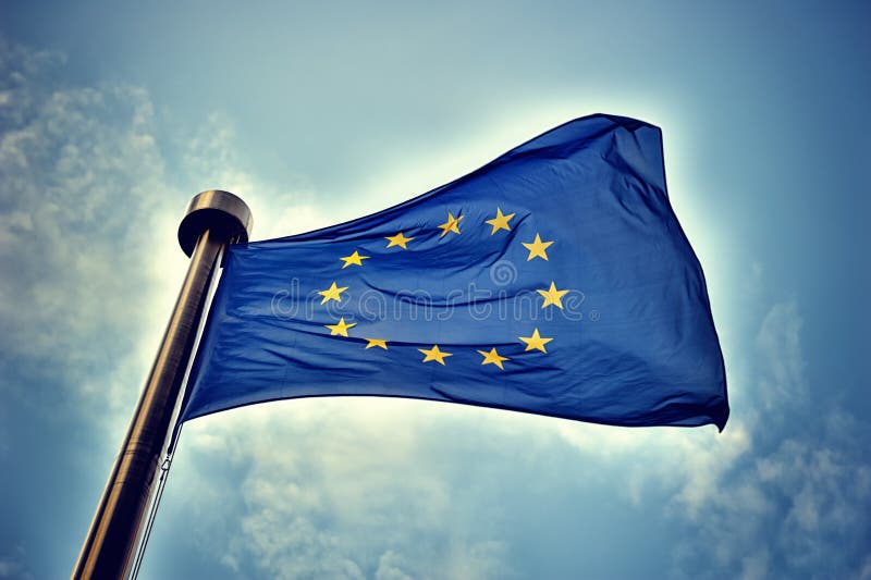 European Union flag on blue sky background. European Union flag on blue sky background