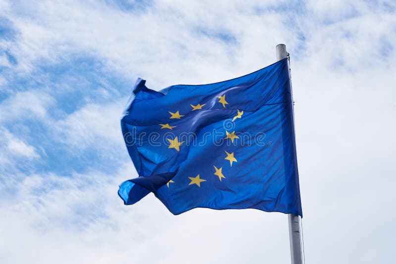 European Union flag with sky in the background - horizontal. European Union flag with sky in the background - horizontal.