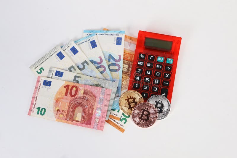 Euroräknemaskin och bitcoins i studion arkivbilder Euroräknemaskin och bitcoins i studion arkivbilder