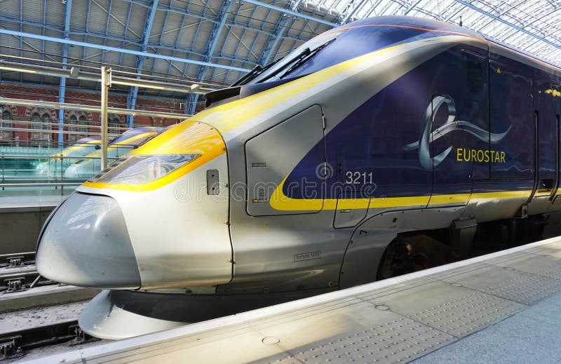 Eurostar train the St Pancras station in London. LONDON, ENGLAND -11 MARCH 2015- The Eurostar high-speed bullet train, which connects Paris Gare du Nord to stock photos Eurostar train the St Pancras station in London. LONDON, ENGLAND -11 MARCH 2015- The Eurostar high-speed bullet train, which connects Paris Gare du Nord to stock photos