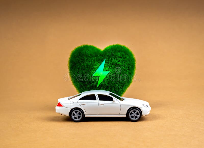 EV car, Electric energy battery charge vehicle with sustainable development concept. White car parked at green heart-shape with electric power icon, alternative energy, brown kraft paper background. Development ev stock images, royalty-free photos and pictures