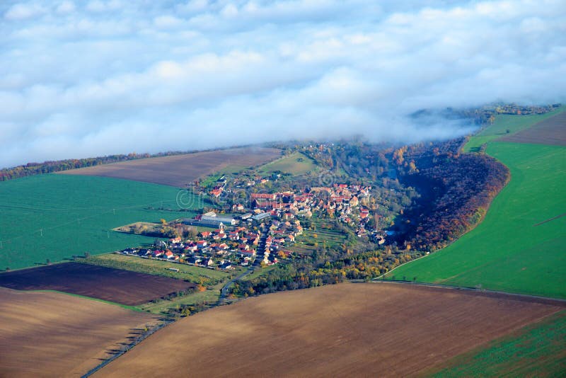 Village Evan, Litomerice, Usti Region - Czech Republic Aerial photo. Inverse clouds. Village Evan, Litomerice, Usti Region - Czech Republic Aerial photo. Inverse clouds.