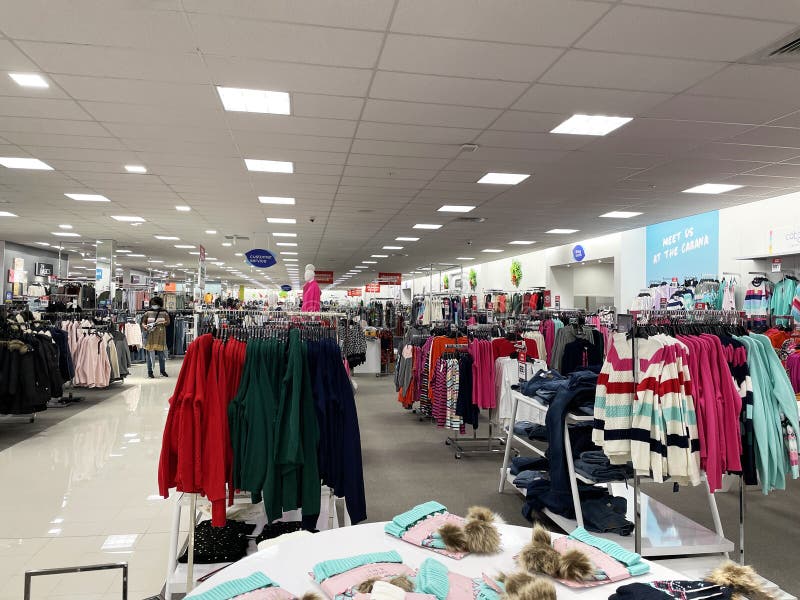 Racks of Sweaters and Shirts Hanging in a Store Stock Image - Image of ...