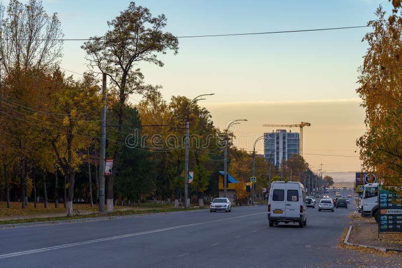 Evening city road at sunset during golden autumn. Background. October 22, 2021 Balti Moldova