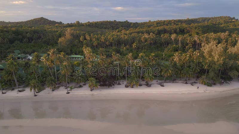 Evening atmosphere at sandy beach island. Perfect aerial top view flight drone