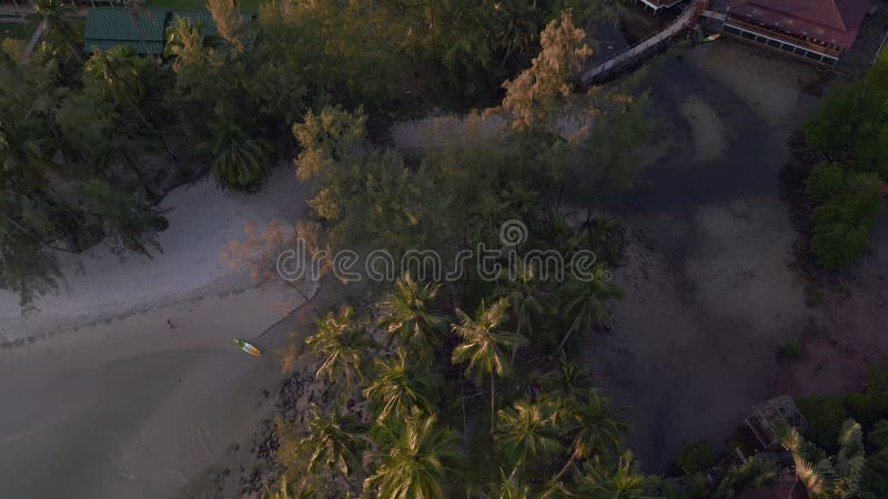 Small lagoon bay in the evening with kayak. Amazing aerial top view flight drone