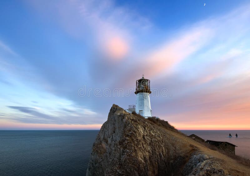 Evening landscape with a lighthouse.