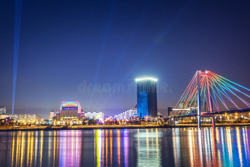 Evening and night Krasnoyarsk, panorama night city. Cable-stayed bridge in bright lights. Urban landscape. royalty free stock photos Evening and night Krasnoyarsk, panorama night city. Cable-stayed bridge in bright lights. Urban landscape. royalty free stock photos