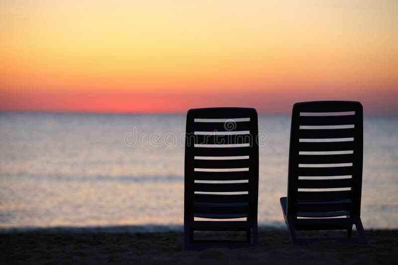 In Evening at Seaside Two Chairs Cost Stock Photo Image of