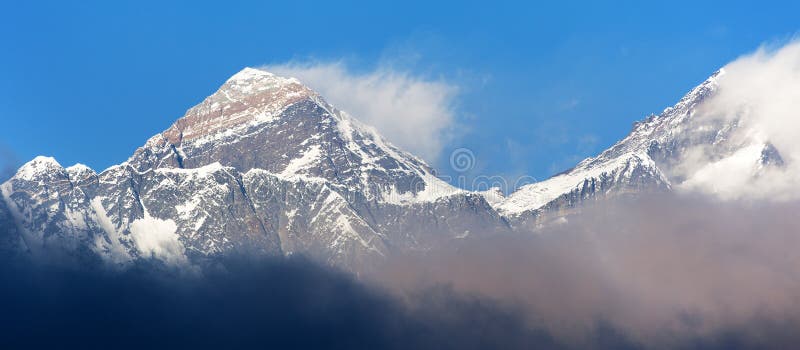 Evening sunset red colored view of Everest and Lhotse with beautiful clouds from Kongde village, Khumbu valley, Solukhumbu, Nepal royalty free stock photography Evening sunset red colored view of Everest and Lhotse with beautiful clouds from Kongde village, Khumbu valley, Solukhumbu, Nepal royalty free stock photography
