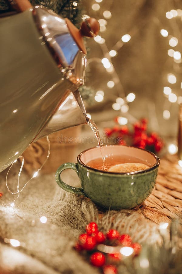 Evening Tea Party with Christmas Lights Hot Tea and Candy Stock Image