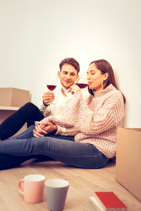 Couple Feeling Relaxed Drinking Some Wine in the Evening Stock Photo