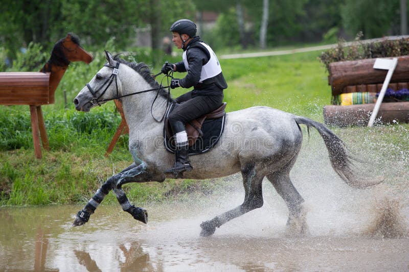 Eventer on Horse is the Water Jump Editorial Stock Photo