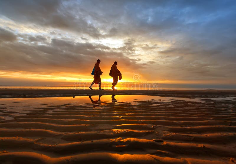 Every mornig monk walk for people offering food. Along huahin beach royalty free stock images