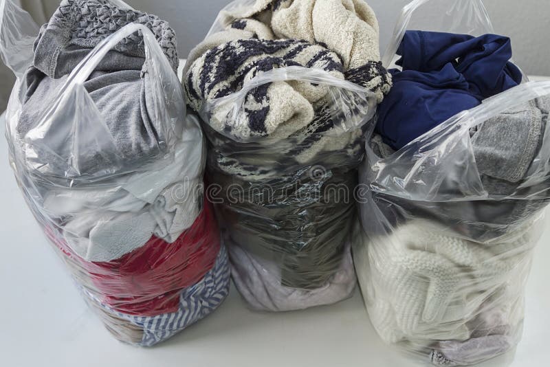 Clothes in plastic bags stock photo. Image of clothing 179130786