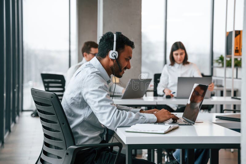 Everyone is Using Laptop. Men and Woman are Working in the Office