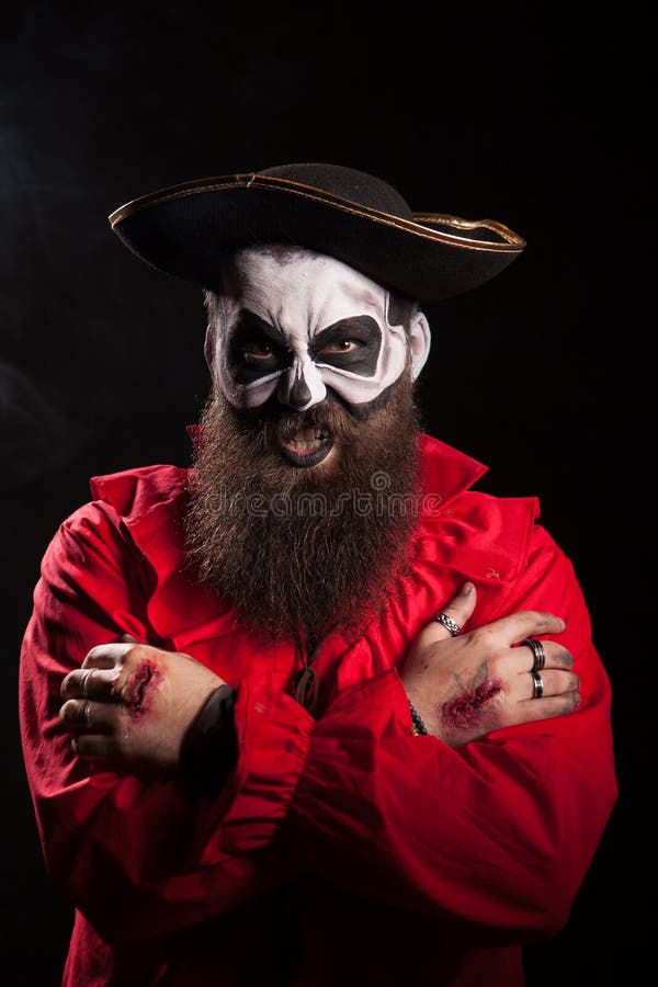 Evil bearded pirate with spooky makeup stock image