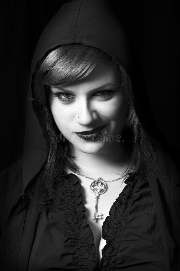 Evil Young Bad Woman. Witch Hooded Head. Smirk Expression. Black