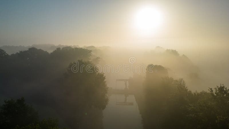 Dawn's Gentle Embrace, Misty Morning Over the River stock photos