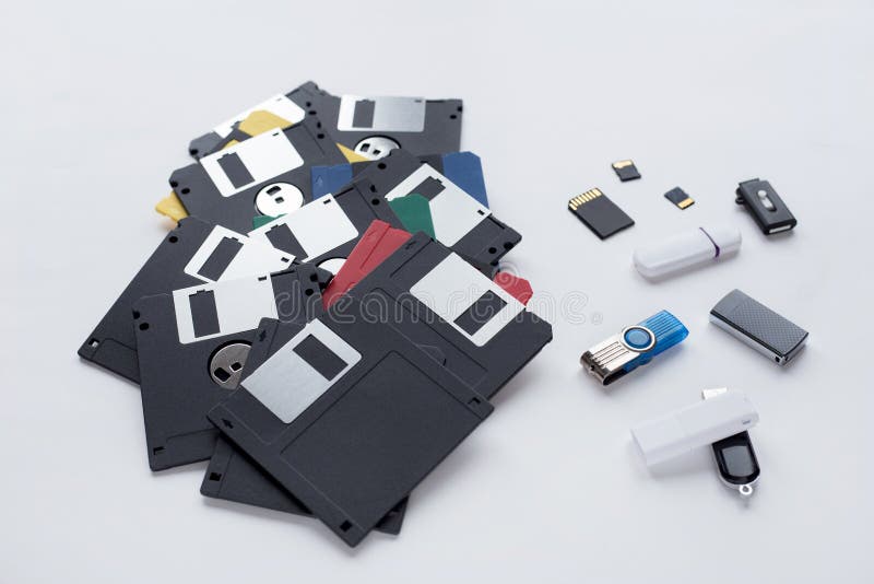 The evolution of digital data storage device. Floppy disks, flash drives and memory cards isolated on white background