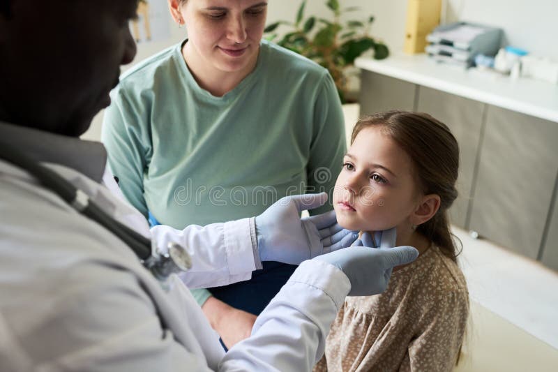 Examining Child During Medical Appointment royalty free stock photo