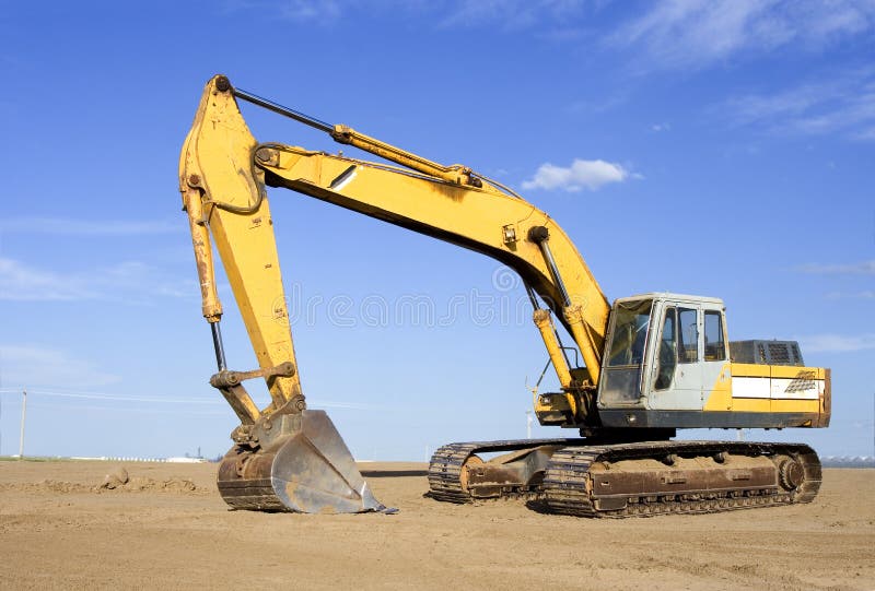 Back hoe on a work site. Claw machine stock images, royalty-free photos and pictures
