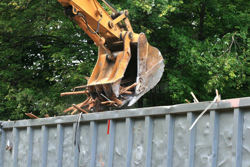 Excavator bucket dumping