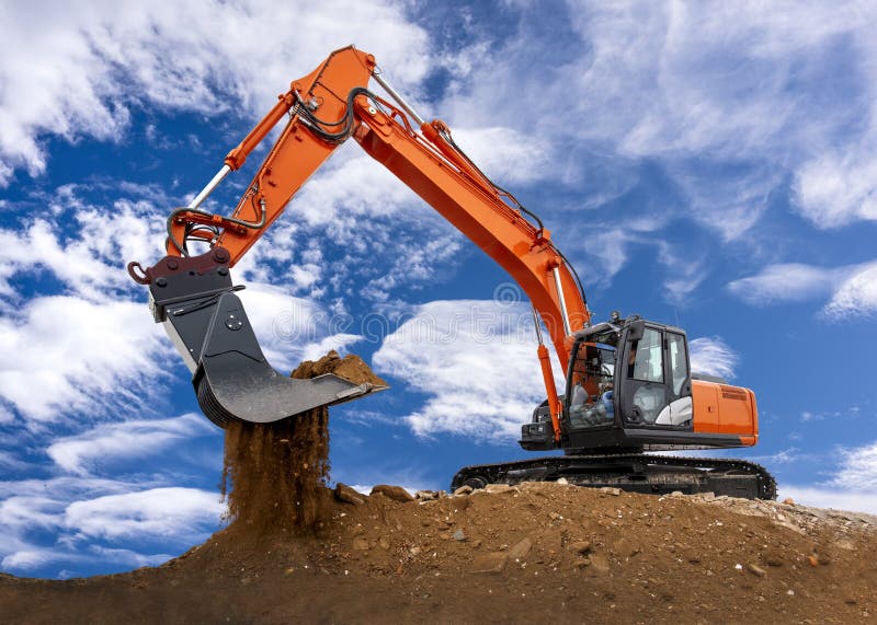 Digging and Loading Sand with a Machine in a Quarry Stock Photo Image
