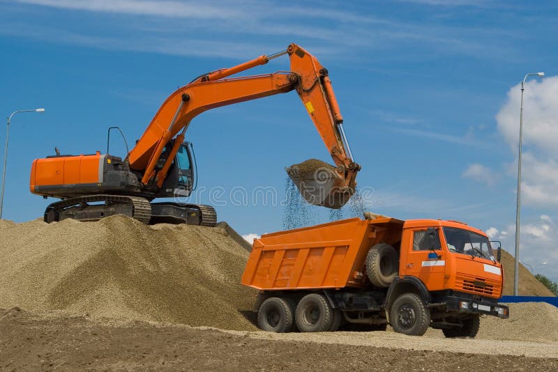Excavator and dump truck stock photo. Image of ballast 13081958