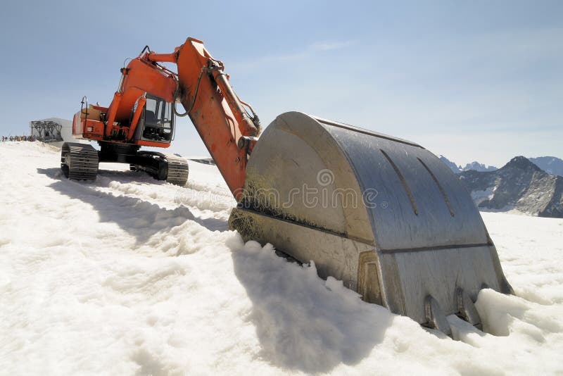 An excavator on the glacier at 3450 meters. Track hoe construction excavator stock images, royalty-free photos and pictures