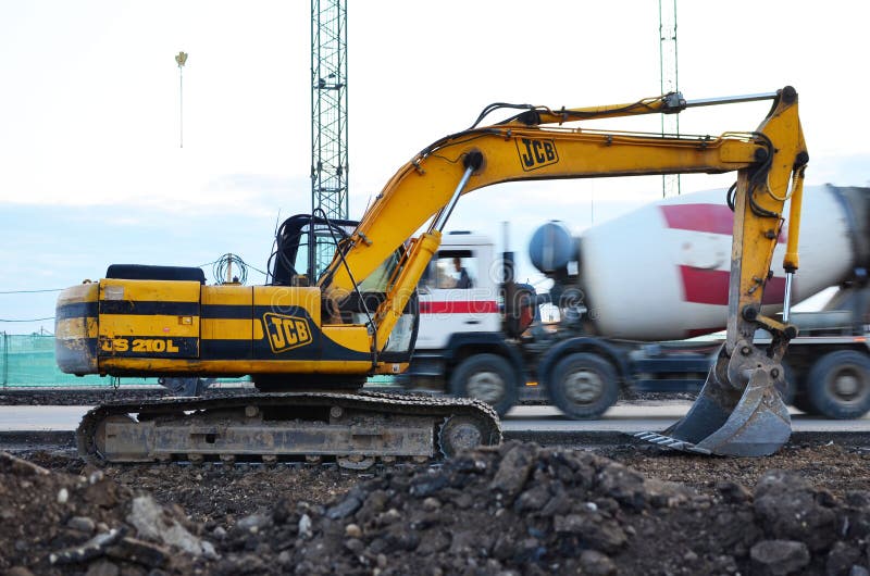 Excavator JCB JS 210 L Working at Construction Site. Construction