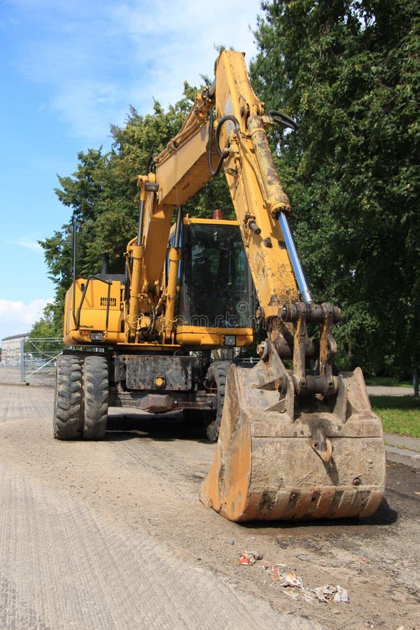 Excavator with a Large Bucket on a Pile of Sand Stock Image Image of