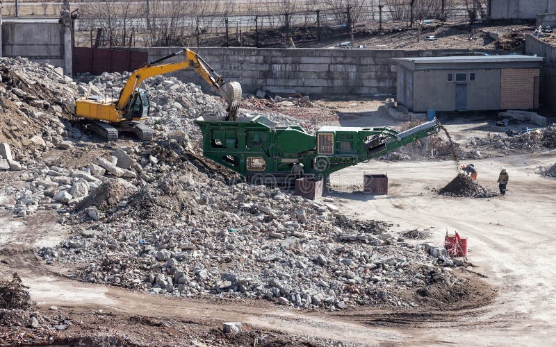 Excavator Loading Soil into Mobile Rock Crusher Stock Photo Image of