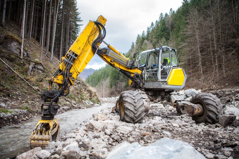 Excavator in a Mountain River Stock Photo Image of mountains