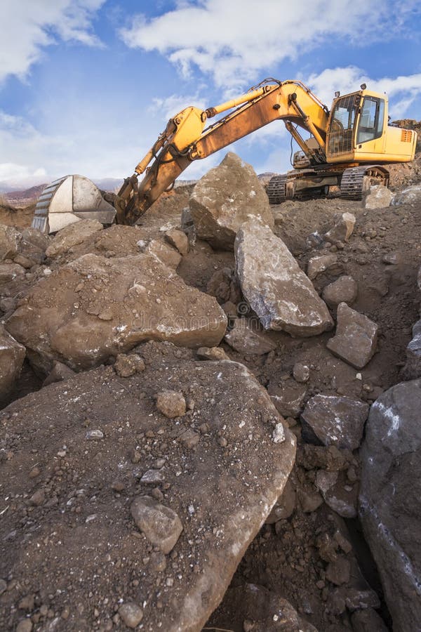 Excavator in a Quarry Extracting Stone Stock Photo Image of scoop