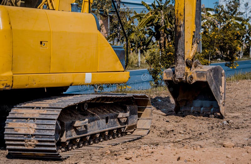 Excavator with Shovel Digs the Ground for the Foundation at Constuction
