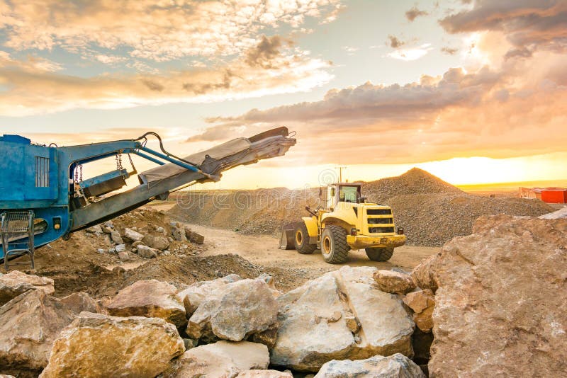 Excavator and Stone Crusher in a Quarry Stock Photo Image of outdoor
