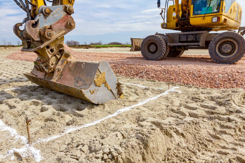 Excavator will dig precise inside marked area at building site