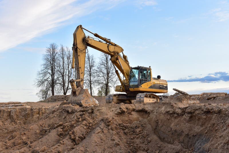 Excavator Working On Earthmoving At Open Pit Mining. Backhoe Digs