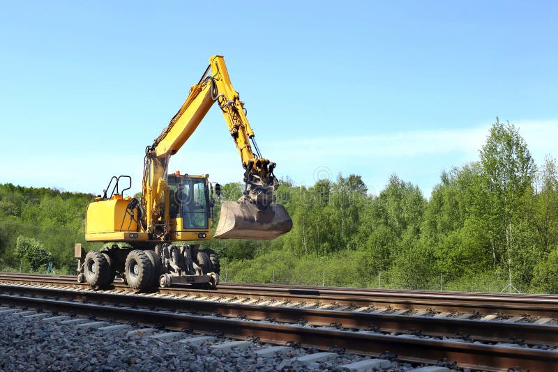 Rail excavator working with rubble.