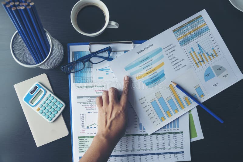 Excel Spreadsheet stats graph analytics data. Accountant hands holding Financial Document Trading Information with excel file. royalty free stock photos