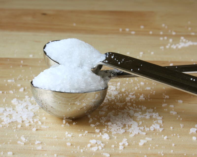 Granulated salt and course kosher salt spilling over in measuring spoons. Kosher stock images, royalty-free photos and pictures